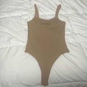 Light brown/tan body suit, unworn, small